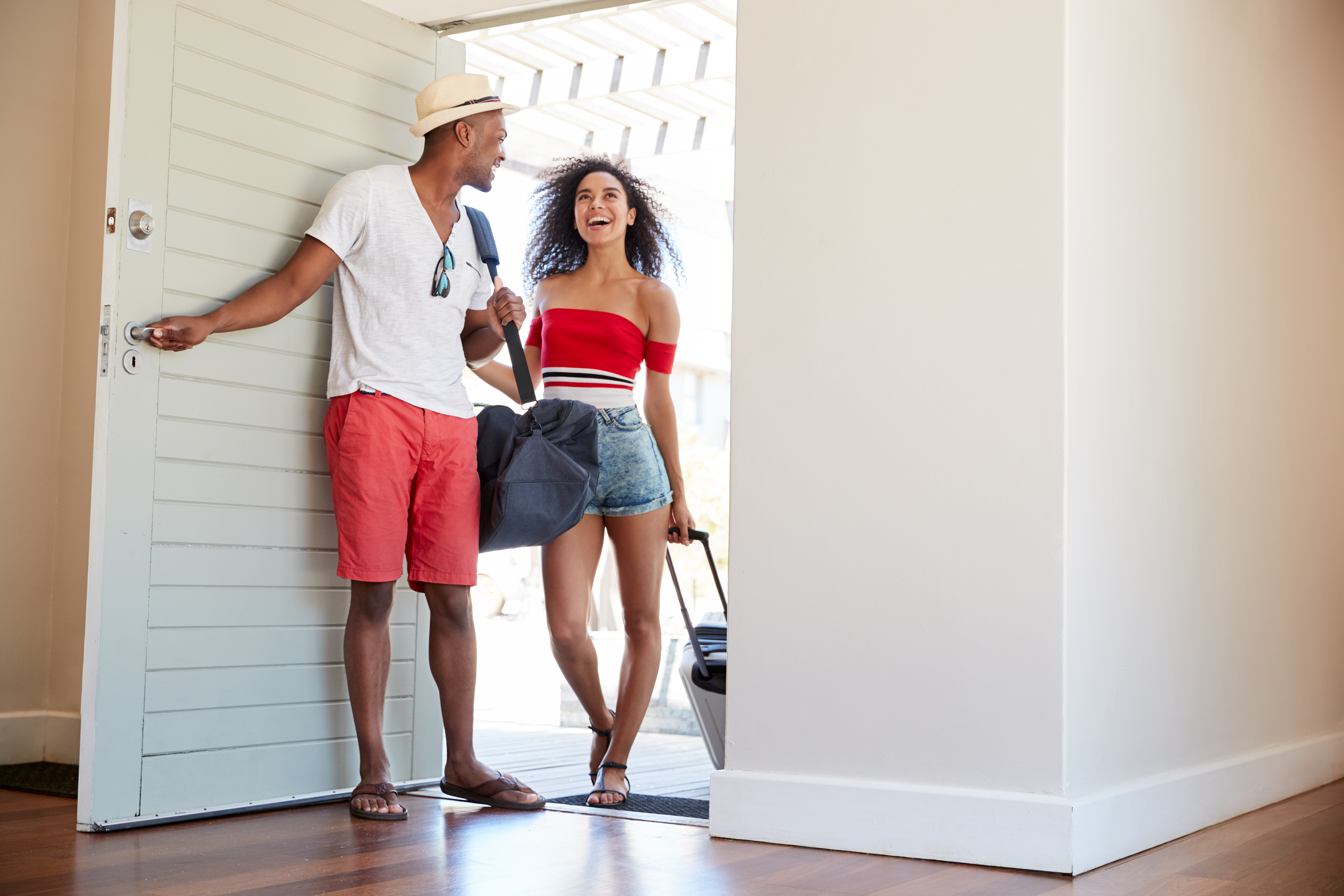 Couple walking into vacation rental